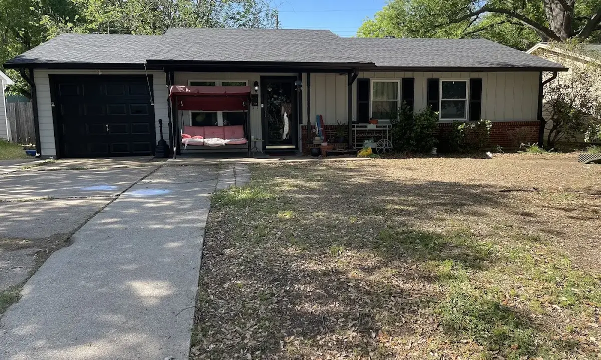 Wind Damage Roof Repair crew at work on a residential roof in Gastonia